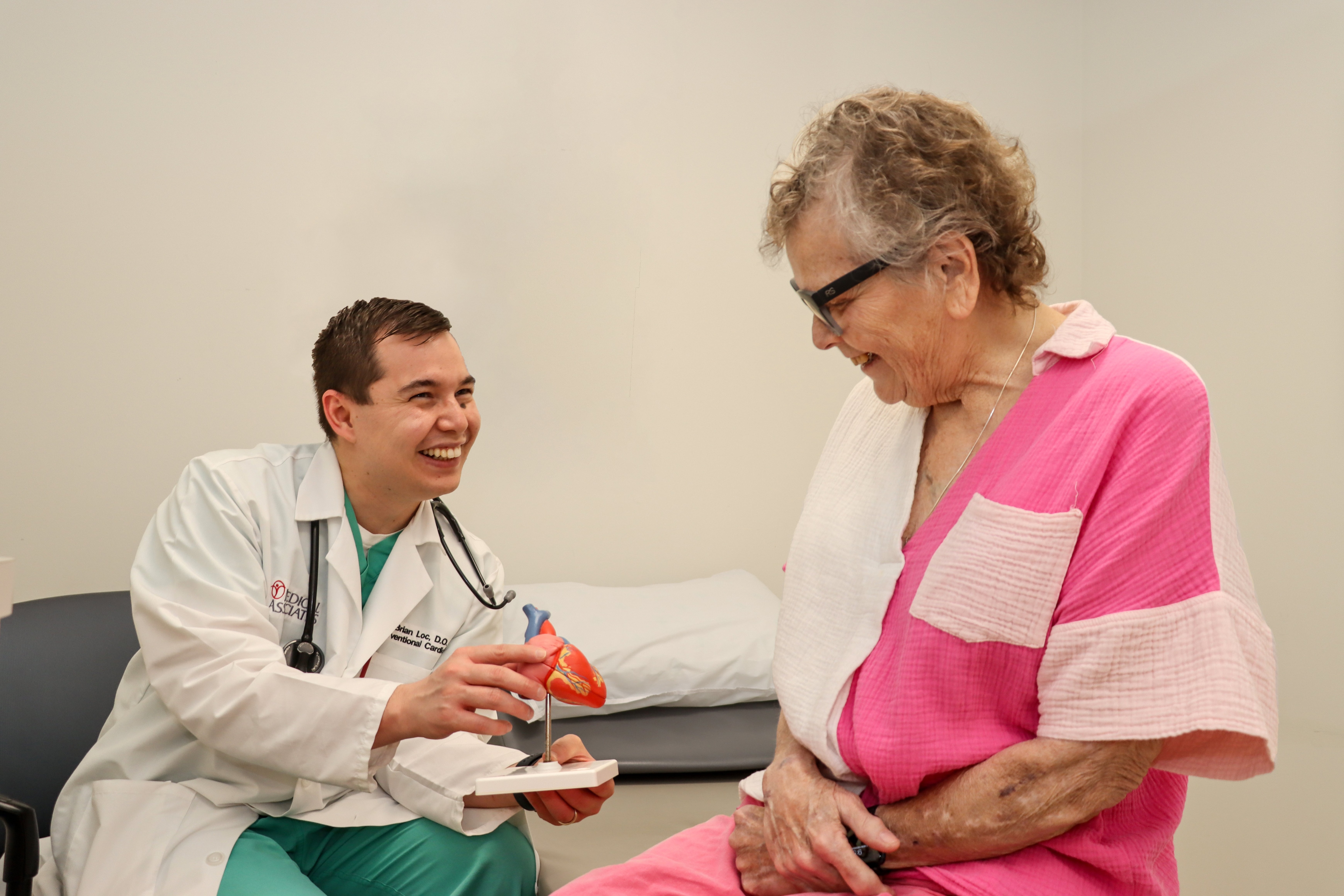 Dr. Loc Showing Patient Heart Model