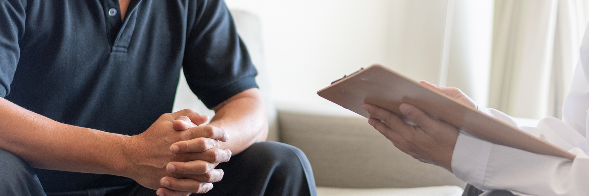 man speaking with doctor