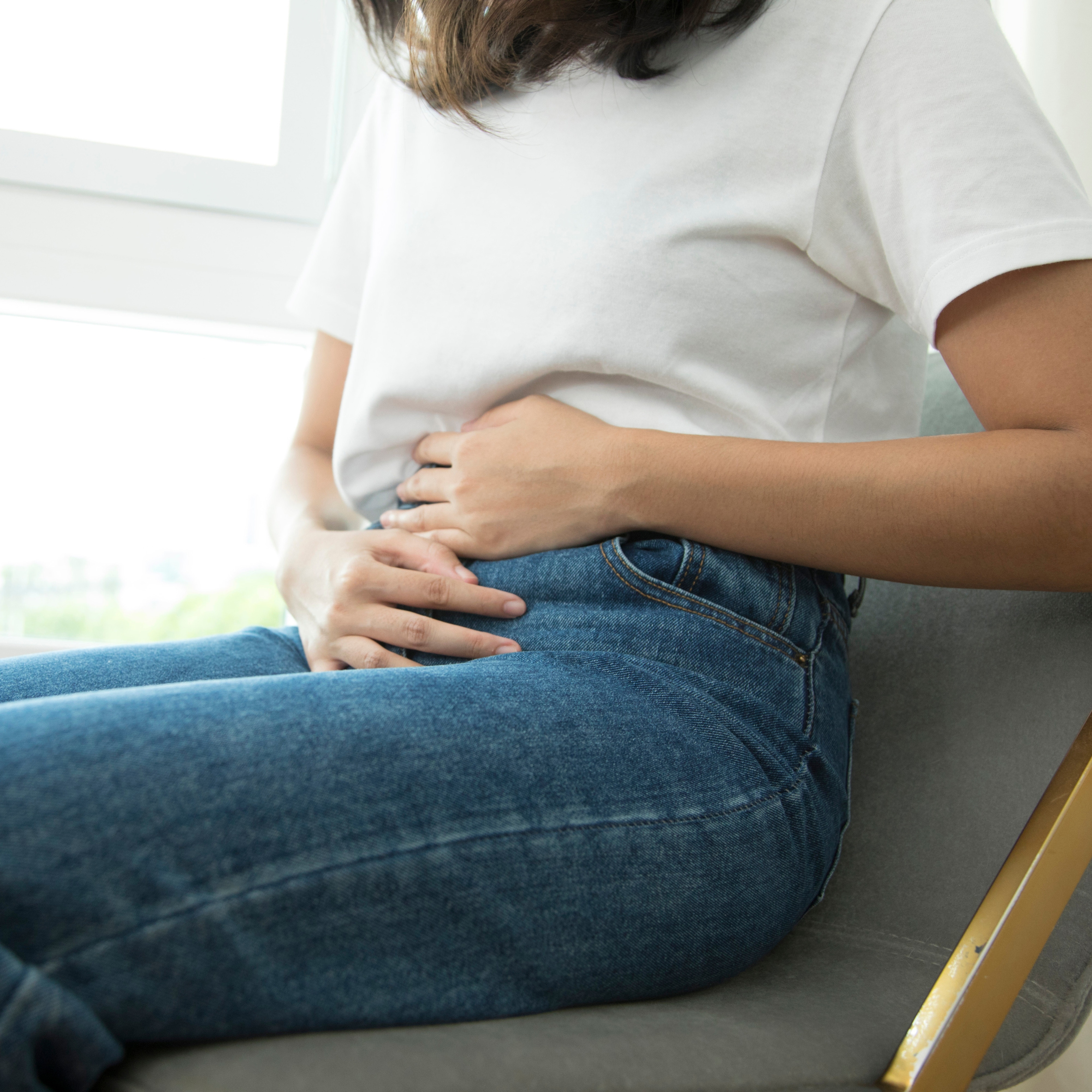 woman holding stomach