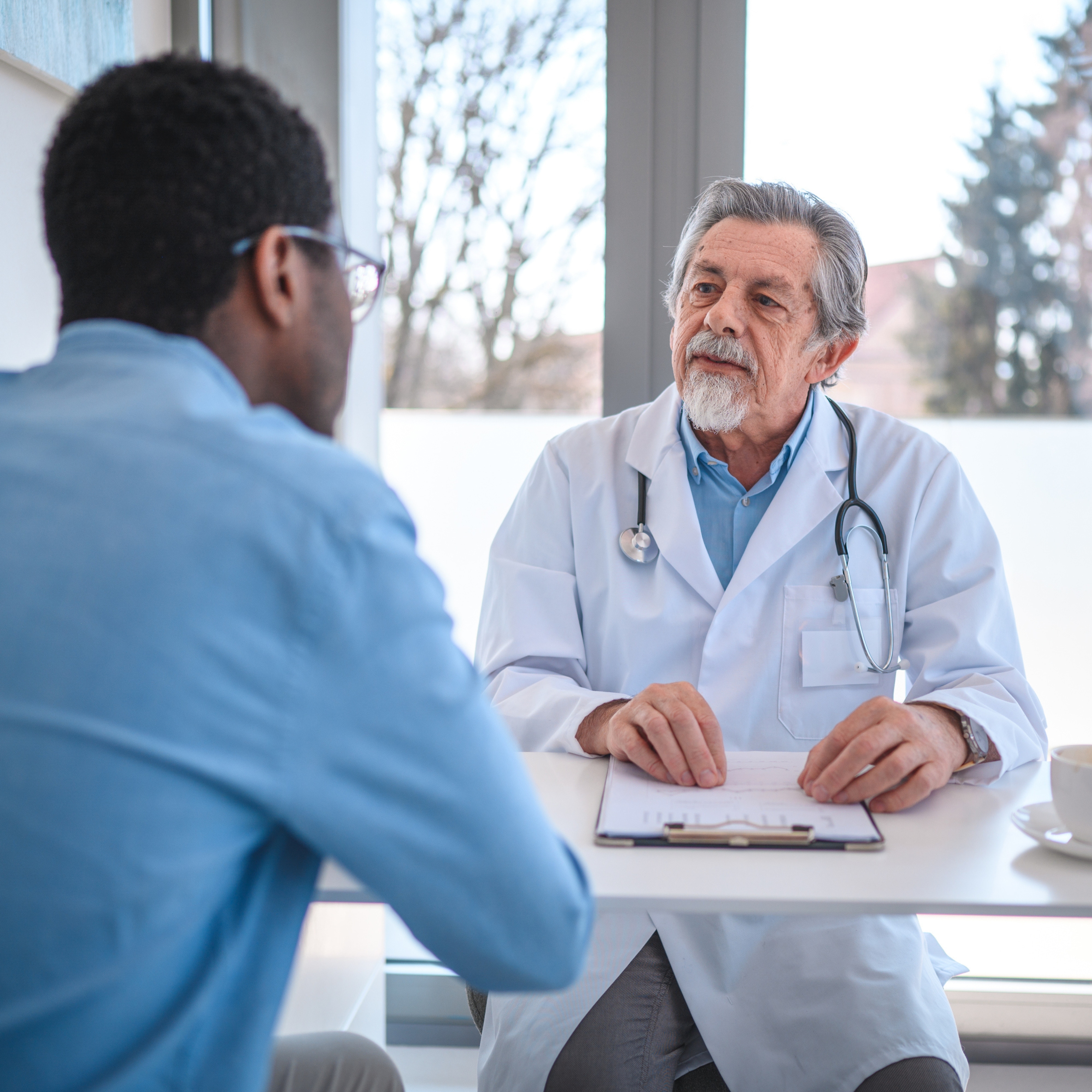 doctor taking to patient