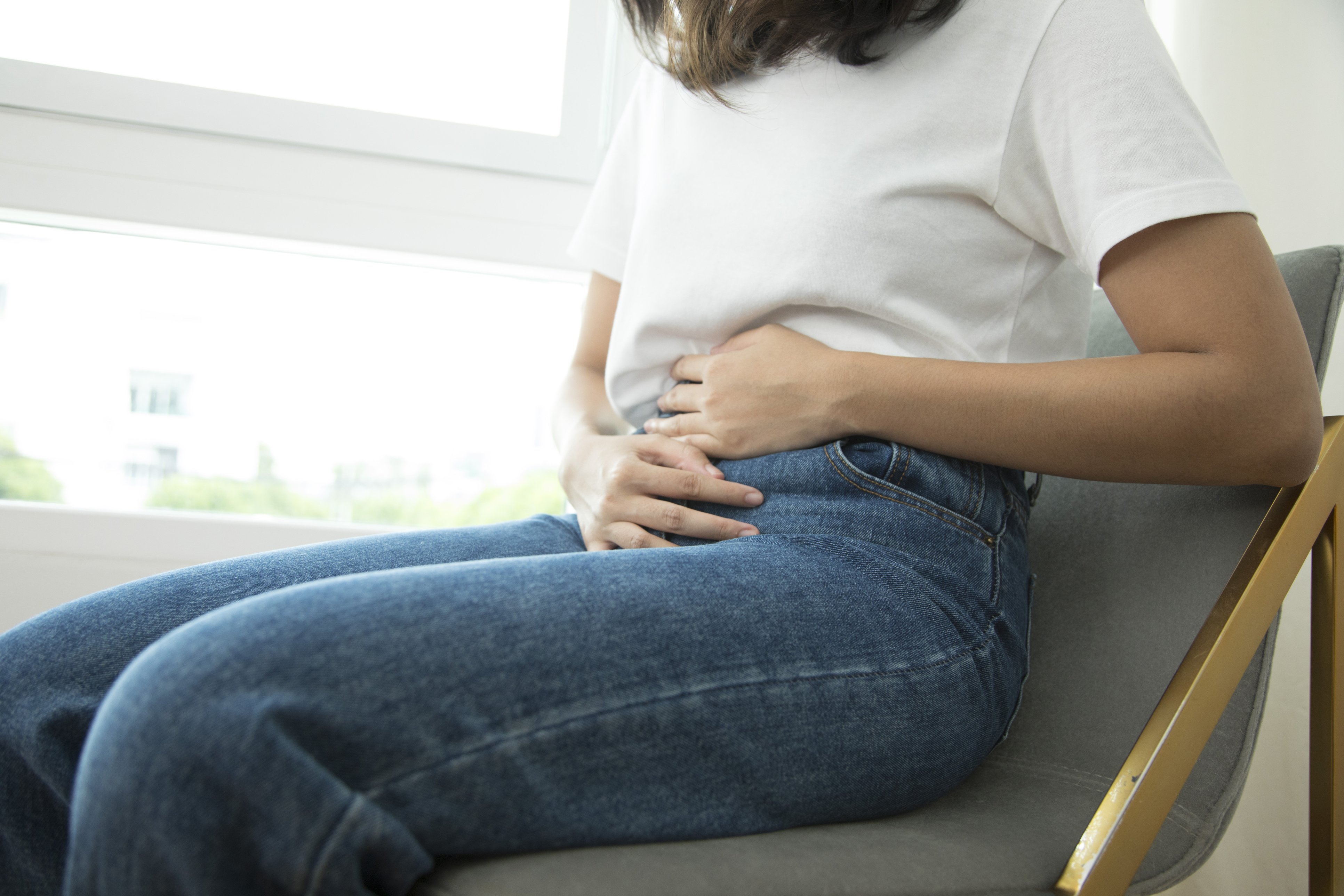 Woman holding stomach