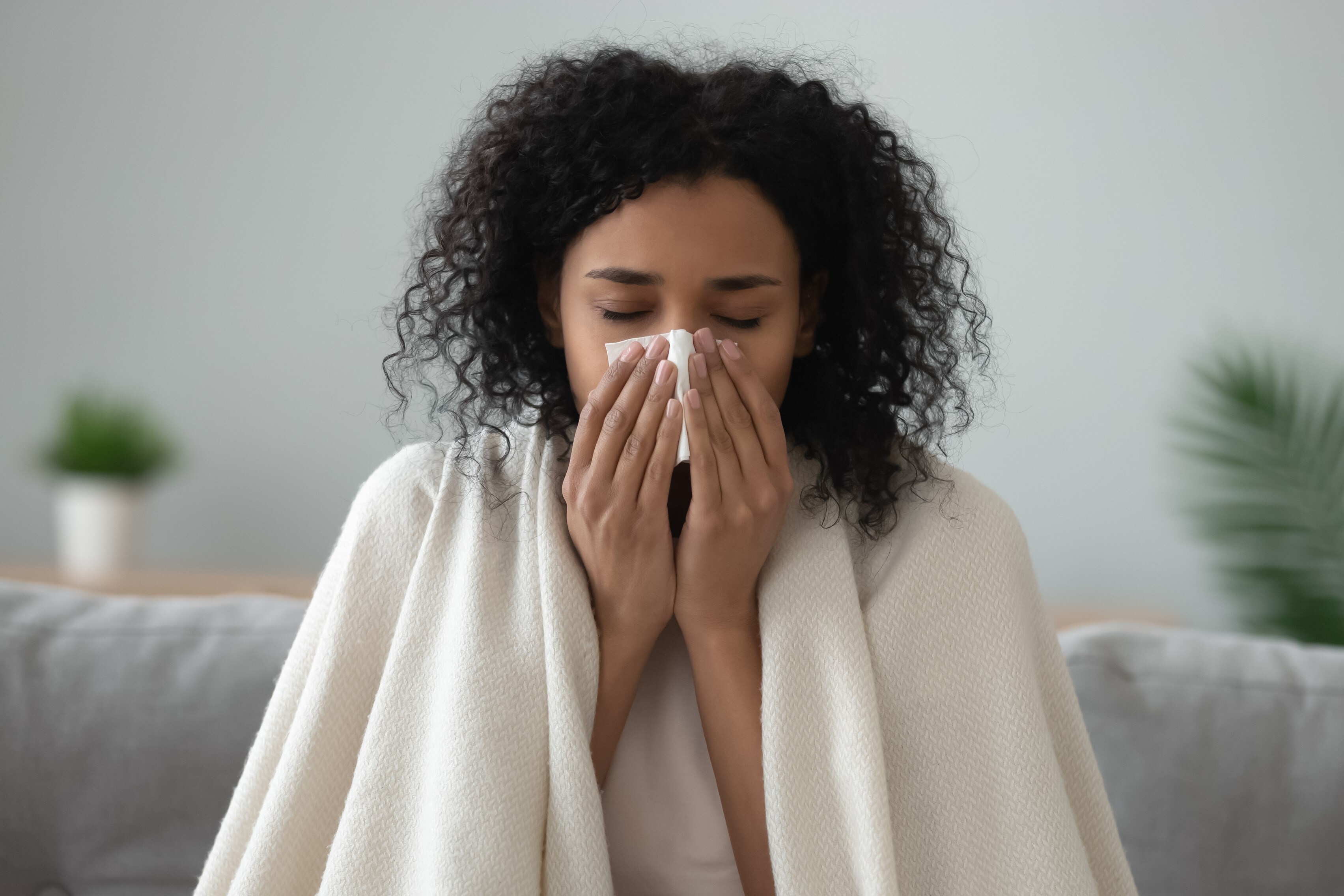 woman blowing nose