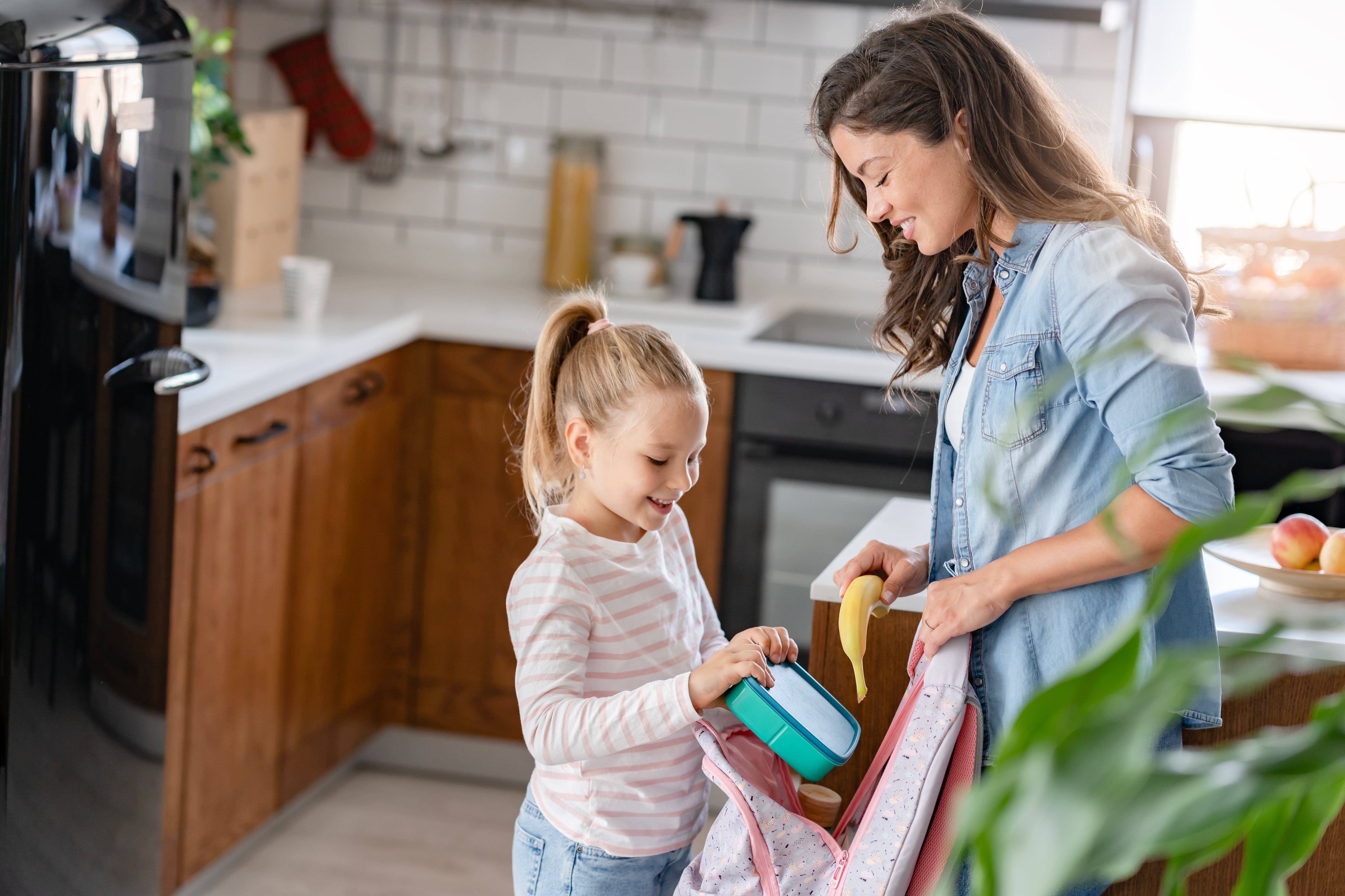 mother and daughter prepping for school