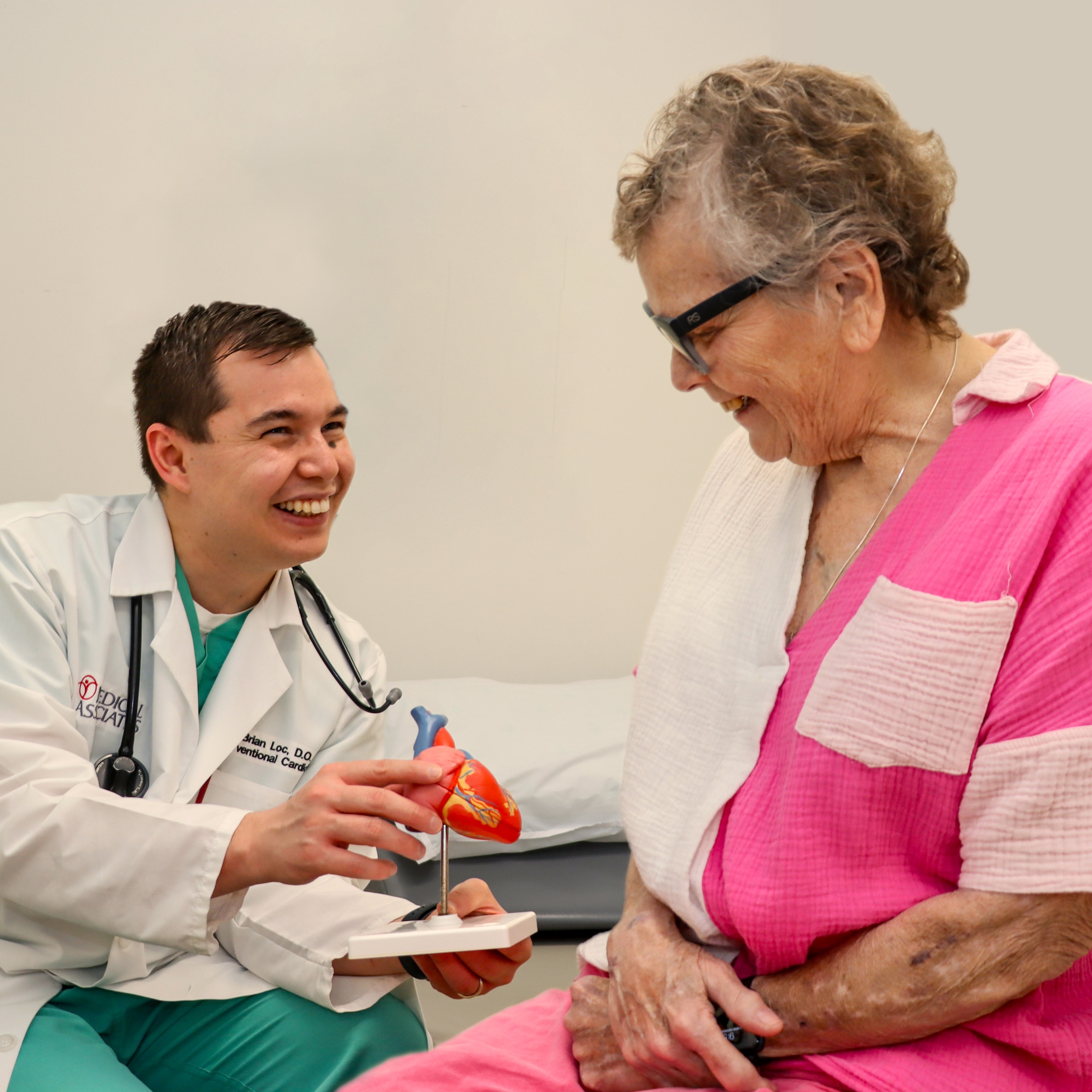 Dr. Loc showing patient heart model